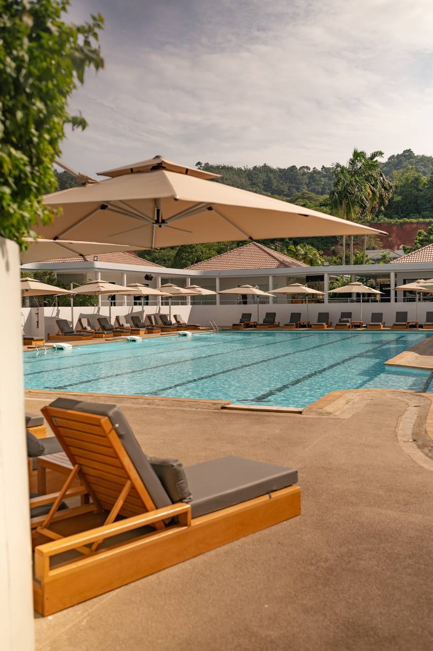 Large comfortable sun loungers by the pool at KAIF Jungle Club & Spa